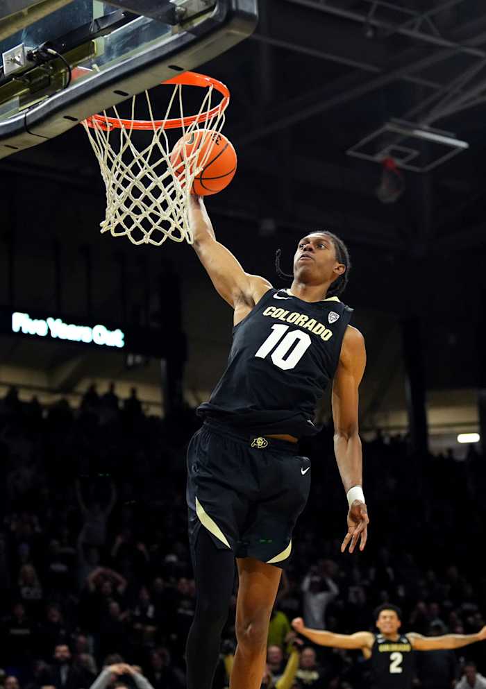 Boulder, Colorado, USA; Colorado Buffaloes forward Cody Williams (10) finishes off a basket in the second half against the USC Trojans at the CU Events Center.